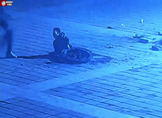 Video :A massive firework is thrown into a manhole by him